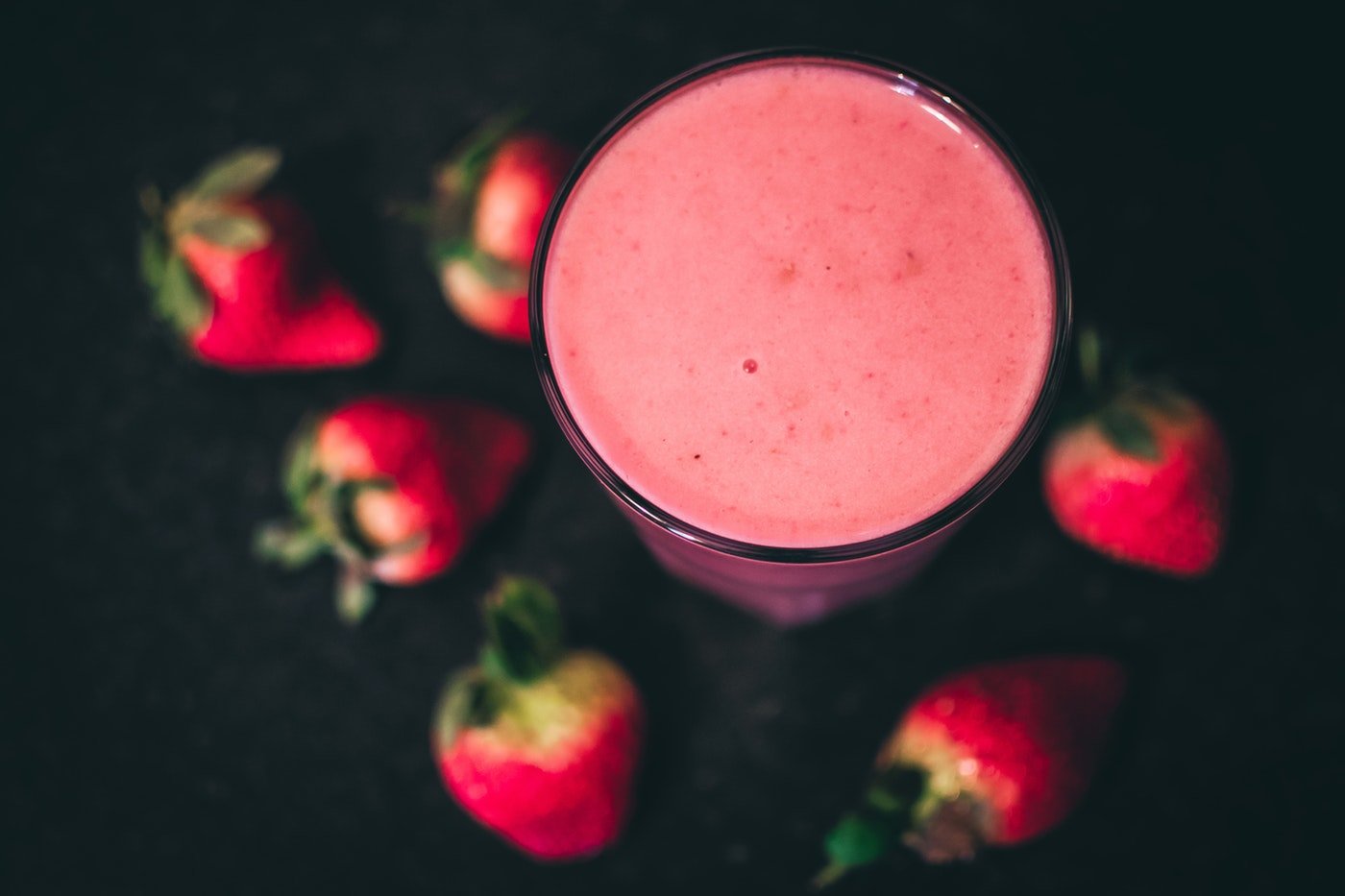 close-up of smoothie with strawberries - adding protein shakes to your diet
