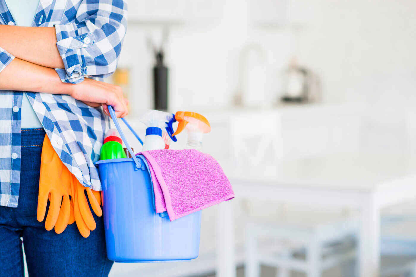woman with cleaning supplies