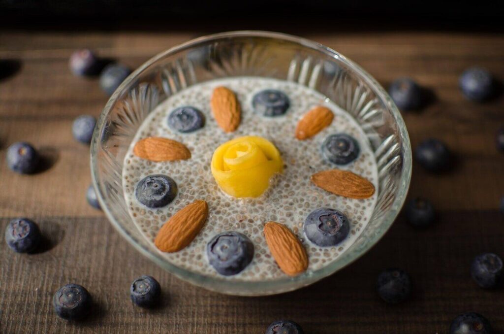 chia bowl with blueberries, almonds and mango - 7 ways to increase protein intake on a vegetarian diet