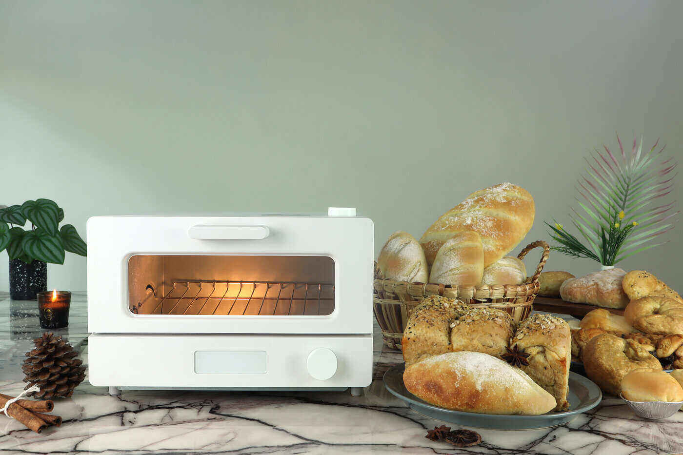 white toaster oven with baskets of bread - best toaster oven reviews and buying guide