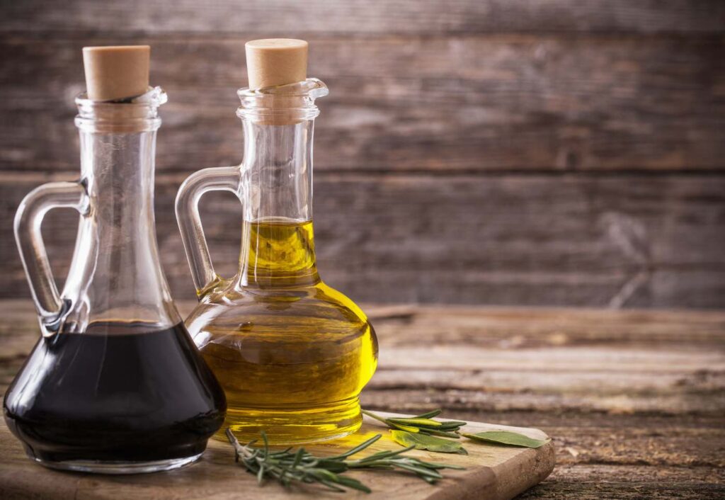 bottles of balsamic vinegar and olive oil - how long does balsamic vinegar last before it goes bad